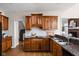 Well-appointed kitchen featuring custom wooden cabinetry, granite countertops and stainless steel sink at 8552 E 550 S, Zionsville, IN 46077