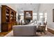 Bright living room with vaulted ceilings, brick fireplace, built-in shelving, and comfortable seating at 8552 E 550 S, Zionsville, IN 46077