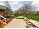 Outdoor patio boasts a hot tub, dining table, bench seating, and string lights at 8552 E 550 S, Zionsville, IN 46077