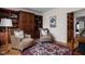 Comfortable sitting room with custom built-in shelving, hardwood floors, and cozy armchairs at 8552 E 550 S, Zionsville, IN 46077