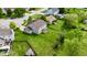 Aerial view of the backyard featuring lush greenery, a patio, and ample space for recreation at 861 Stardust Ct, Franklin, IN 46131