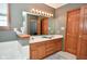 Double vanity bathroom with wood cabinets at 861 Stardust Ct, Franklin, IN 46131