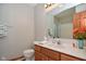 Bathroom with wood cabinets and a large mirror at 861 Stardust Ct, Franklin, IN 46131