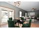 Cozy dining area with modern lighting, a table with seating for four, and french doors to backyard at 861 Stardust Ct, Franklin, IN 46131