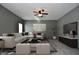 Comfortable living room featuring plush seating, a ceiling fan, and a mounted television at 861 Stardust Ct, Franklin, IN 46131