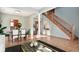 Open-concept living space with hardwood floors, a staircase, and ample natural light at 861 Stardust Ct, Franklin, IN 46131
