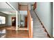 Elegant staircase with wood railings and gray carpeting, leading to upper level at 861 Stardust Ct, Franklin, IN 46131