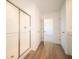 Modern bathroom featuring glass enclosed shower and wood look flooring, offering an efficient layout at 8703 Duncan St, Fortville, IN 46040