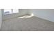 Well-lit bedroom featuring neutral carpeting and large window at 8703 Duncan St, Fortville, IN 46040
