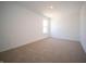 Bright bedroom featuring neutral carpet, ample natural light, and a fresh, clean aesthetic at 8703 Duncan St, Fortville, IN 46040
