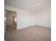 Carpeted bedroom featuring neutral decor, and access to other rooms creating an adaptable space at 8703 Duncan St, Fortville, IN 46040