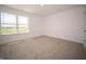Well-lit bedroom showcasing a large window with a serene view of the surrounding landscape at 8703 Duncan St, Fortville, IN 46040