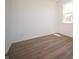 Cozy bedroom with wood-look flooring and ample natural light at 8703 Duncan St, Fortville, IN 46040