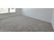 Bedroom with neutral carpeting and large window at 8703 Duncan St, Fortville, IN 46040