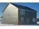 Green two story house with a gray roof and brick base at 8703 Duncan St, Fortville, IN 46040