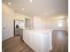 Bright, open kitchen featuring a large island, stainless appliances, and stylish wood-look flooring at 8703 Duncan St, Fortville, IN 46040