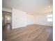 Inviting living space featuring neutral walls, recessed lights, and wood-look floors, creating a modern aesthetic at 8703 Duncan St, Fortville, IN 46040
