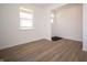 Bright, open living area with modern flooring and a view of the outdoors at 8703 Duncan St, Fortville, IN 46040