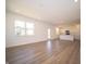 Open-concept layout featuring hardwood floors, recessed lighting, and a seamless flow into the kitchen at 8703 Duncan St, Fortville, IN 46040
