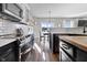 Modern kitchen with stainless steel appliances and white cabinetry at 8841 Weather Stone Xing, Zionsville, IN 46077