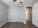 Simple bedroom with wood-look floors and neutral walls at 935 S Morgantown Rd, Greenwood, IN 46143