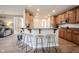 Kitchen boasts a breakfast bar, light wood cabinets, and granite countertops at 11474 Loch Raven Blvd, Fishers, IN 46037