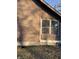 Brown wooden siding with screened porch and foundation at 1420 W 23Rd St, Indianapolis, IN 46208