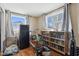 Bedroom with hardwood floors, built-in shelving, and a bike at 1650 Stout St, Martinsville, IN 46151