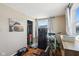 Bedroom with hardwood floors, a bike, and a pet crate at 1650 Stout St, Martinsville, IN 46151