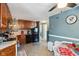 Cozy kitchen featuring wood cabinets, black appliances, and tile flooring at 1650 Stout St, Martinsville, IN 46151