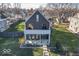 Modern home with gray siding, a balcony, and a landscaped yard at 1948 Central Ave, Indianapolis, IN 46202