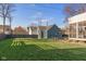 Spacious backyard with grassy lawn and modern fence at 1948 Central Ave, Indianapolis, IN 46202