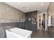 Modern bathroom with walk-in shower and a free-standing bathtub at 1948 Central Ave, Indianapolis, IN 46202