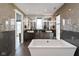 Elegant bathroom with a freestanding tub and double vanities at 1948 Central Ave, Indianapolis, IN 46202