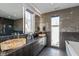 Spa-like bathroom with double sinks, stone countertops, and a large soaking tub at 1948 Central Ave, Indianapolis, IN 46202