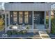 Modern front porch with concrete flooring and planters at 1948 Central Ave, Indianapolis, IN 46202