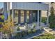 Modern front porch with concrete flooring and planters at 1948 Central Ave, Indianapolis, IN 46202