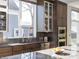 Modern kitchen with dark wood cabinets and granite countertops at 1948 Central Ave, Indianapolis, IN 46202