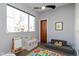 Bright playroom with toys, colorful rug, and large window at 1948 Central Ave, Indianapolis, IN 46202