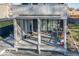 Screened porch with gray wood flooring and toys at 1948 Central Ave, Indianapolis, IN 46202