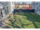 Large grassy side yard with modern fence at 1948 Central Ave, Indianapolis, IN 46202