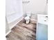 Clean bathroom with a tub, shower, toilet, and vanity at 2119 Noble St, Anderson, IN 46016