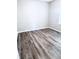 Simple bedroom with gray walls and gray vinyl plank flooring at 2119 Noble St, Anderson, IN 46016