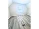 Bright bedroom featuring wood-look floors and a window at 2119 Noble St, Anderson, IN 46016