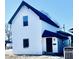 Charming two-story house with white siding and a dark blue roof at 2119 Noble St, Anderson, IN 46016