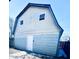 Detached garage with white door and two windows at 2119 Noble St, Anderson, IN 46016