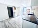 White kitchen cabinets, dark countertops, and gray vinyl flooring at 2119 Noble St, Anderson, IN 46016