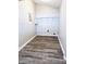 Laundry room with gray walls, gray vinyl flooring, and wire shelving at 2119 Noble St, Anderson, IN 46016
