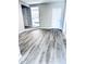 Open living space with gray walls and wood-look vinyl flooring at 2119 Noble St, Anderson, IN 46016