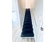 Modern staircase with black treads and white railings at 2119 Noble St, Anderson, IN 46016